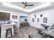 Basement featuring a wet bar, large screen TV, tray ceiling, and leather reclining seating at 1007 143Rd Ne St, Bradenton, FL 34212