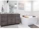 Bright bathroom with modern soaking tub, granite countertops, and stylish vanity at 1007 143Rd Ne St, Bradenton, FL 34212