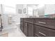 Bathroom featuring a granite countertop, wood cabinets, and tiled floors at 1007 143Rd Ne St, Bradenton, FL 34212