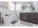 This bathroom features an elegant soaking tub, plantation shutters, and a modern vanity at 1007 143Rd Ne St, Bradenton, FL 34212