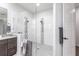 Bright bathroom featuring a glass shower with modern tile and granite countertops, and vessel sink at 1007 143Rd Ne St, Bradenton, FL 34212