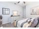 Charming bedroom with a ceiling fan featuring a comfortable bed, dresser, and decorative accents at 1007 143Rd Ne St, Bradenton, FL 34212