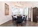 Cozy dining room featuring a modern chandelier, natural light, and stylish furniture at 1007 143Rd Ne St, Bradenton, FL 34212