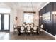 Elegant dining room features a wooden table and a stylish chandelier at 1007 143Rd Ne St, Bradenton, FL 34212