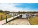 Lush landscaping surrounds this private dock and boat launch, leading out to a beautiful, tranquil lake at 1007 143Rd Ne St, Bradenton, FL 34212