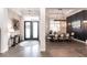 Stylish entry with brick wall detail flowing into a beautifully decorated dining area at 1007 143Rd Ne St, Bradenton, FL 34212