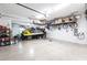 Spacious garage with overhead storage racks, a watercraft, and ample room at 1007 143Rd Ne St, Bradenton, FL 34212