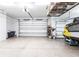 Spacious garage interior with large doors and a storage rack above at 1007 143Rd Ne St, Bradenton, FL 34212