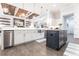 Large kitchen features stainless appliances, white cabinets, and a dark island at 1007 143Rd Ne St, Bradenton, FL 34212