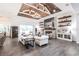 Spacious open-concept living room with a vaulted ceiling, brick fireplace, and plenty of natural light at 1007 143Rd Ne St, Bradenton, FL 34212