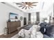 Comfortable main bedroom features wooden furniture, tray ceiling, and bright natural light at 1007 143Rd Ne St, Bradenton, FL 34212
