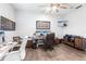 A home office with dual monitors, hard wood floors, and a ceiling fan at 1007 143Rd Ne St, Bradenton, FL 34212