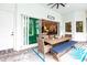 Outdoor patio features a large sliding glass door and a dining area with a wooden table at 1007 143Rd Ne St, Bradenton, FL 34212