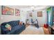 Bedroom featuring a sofa, fitness bike and brightly colored artwork at 1111 W Faith Cir # 2004, Bradenton, FL 34212
