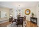 Inviting dining room with hardwood floors, modern chandelier, and view to entry at 1111 W Faith Cir # 2004, Bradenton, FL 34212