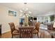 Inviting dining area with a modern chandelier and views into the bright, open-concept living space at 1111 W Faith Cir # 2004, Bradenton, FL 34212