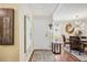 Inviting entryway with hardwood floors leading to a dining area, decorated with modern accents at 1111 W Faith Cir # 2004, Bradenton, FL 34212