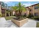 Condo exterior showcasing a well-maintained lawn, mature landscaping, and inviting architectural details at 1111 W Faith Cir # 2004, Bradenton, FL 34212