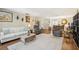 Spacious living room featuring a plush white sofa, comfortable seating, and ample natural light at 1111 W Faith Cir # 2004, Bradenton, FL 34212