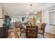 Open-concept living space, featuring hardwood floors, modern lighting, and a seamless flow between rooms at 1111 W Faith Cir # 2004, Bradenton, FL 34212