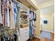 Walk-in closet with built-in storage, adjacent to the main bathroom at 1111 W Faith Cir # 2004, Bradenton, FL 34212