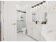 Elegant bathroom featuring a glass shower, soaking tub, and modern fixtures at 1189 Fraser Pine Blvd, Sarasota, FL 34240
