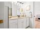 Bright bathroom vanity and access to an adjacent bedroom at 1189 Fraser Pine Blvd, Sarasota, FL 34240