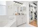 Bright bathroom features a soaking tub and a walk-in closet at 1189 Fraser Pine Blvd, Sarasota, FL 34240