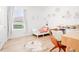 Bright bedroom with hardwood floors, a window, and a cozy rug at 1189 Fraser Pine Blvd, Sarasota, FL 34240