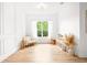 Bright bedroom with natural light from the window, stylish décor, and minimalist design at 1189 Fraser Pine Blvd, Sarasota, FL 34240