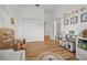 Bright bedroom leads to bathroom; hardwood floors; playful decorations at 1189 Fraser Pine Blvd, Sarasota, FL 34240