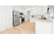 Modern kitchen featuring stainless steel appliances, white cabinets, and sleek countertops at 1189 Fraser Pine Blvd, Sarasota, FL 34240