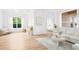Bright living area with tile floors, contemporary décor, and seamless connection to the outdoor spaces at 1189 Fraser Pine Blvd, Sarasota, FL 34240