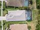 Aerial view of this home with a screened pool, well maintained landscaping, and concrete roof at 12272 Stuart Dr, Venice, FL 34293