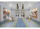 Bright amenity center boasting ample seating, stylish ceiling fans, and access to a modern fitness center at 12272 Stuart Dr, Venice, FL 34293