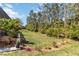 Expansive backyard features lush landscaping and a well-maintained lawn at 12272 Stuart Dr, Venice, FL 34293