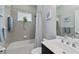 Cozy bathroom featuring tub-shower combination and single vanity sink at 12272 Stuart Dr, Venice, FL 34293