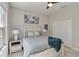 Bright bedroom with large window, ceiling fan, and tranquil decor at 12272 Stuart Dr, Venice, FL 34293