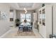 Bright dining room with decorative lighting and furniture at 12272 Stuart Dr, Venice, FL 34293