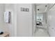 Hallway leading into the main bedroom with ensuite bath at 12272 Stuart Dr, Venice, FL 34293