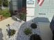 A close-up of the landscaping in front of the home featuring solar lights at 12272 Stuart Dr, Venice, FL 34293