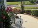 Home landscaping with white gravel, pink flowers, and solar lights next to the walkway at 12272 Stuart Dr, Venice, FL 34293