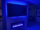 Living room featuring a modern fireplace and large screen tv with accent lighting at 12272 Stuart Dr, Venice, FL 34293