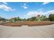 Outdoor playground with slides, climbing structures, and a shaded seating area at 12272 Stuart Dr, Venice, FL 34293