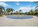 A well-maintained splash pad with various water features, surrounded by palm trees, perfect for Gathering fun at 12272 Stuart Dr, Venice, FL 34293
