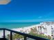 Expansive beach view from a private balcony, ideal for enjoying the serene coastal scenery at 1281 Gulf Of Mexico Dr # 704, Longboat Key, FL 34228