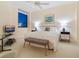 Comfortable bedroom with neutral decor, a large window, and a ceiling fan for added comfort at 1281 Gulf Of Mexico Dr # 704, Longboat Key, FL 34228