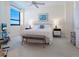 Cozy bedroom with beach view window, stylish nightstands, and a comfortable bench for a relaxing atmosphere at 1281 Gulf Of Mexico Dr # 704, Longboat Key, FL 34228