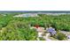 Expansive aerial view of a private home nestled in a lush, green landscape and a screened-in pool at 15107 3Rd E Dr, Bradenton, FL 34212