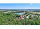 Aerial view of the property surrounded by lush greenery, offering privacy and serenity at 15107 3Rd E Dr, Bradenton, FL 34212